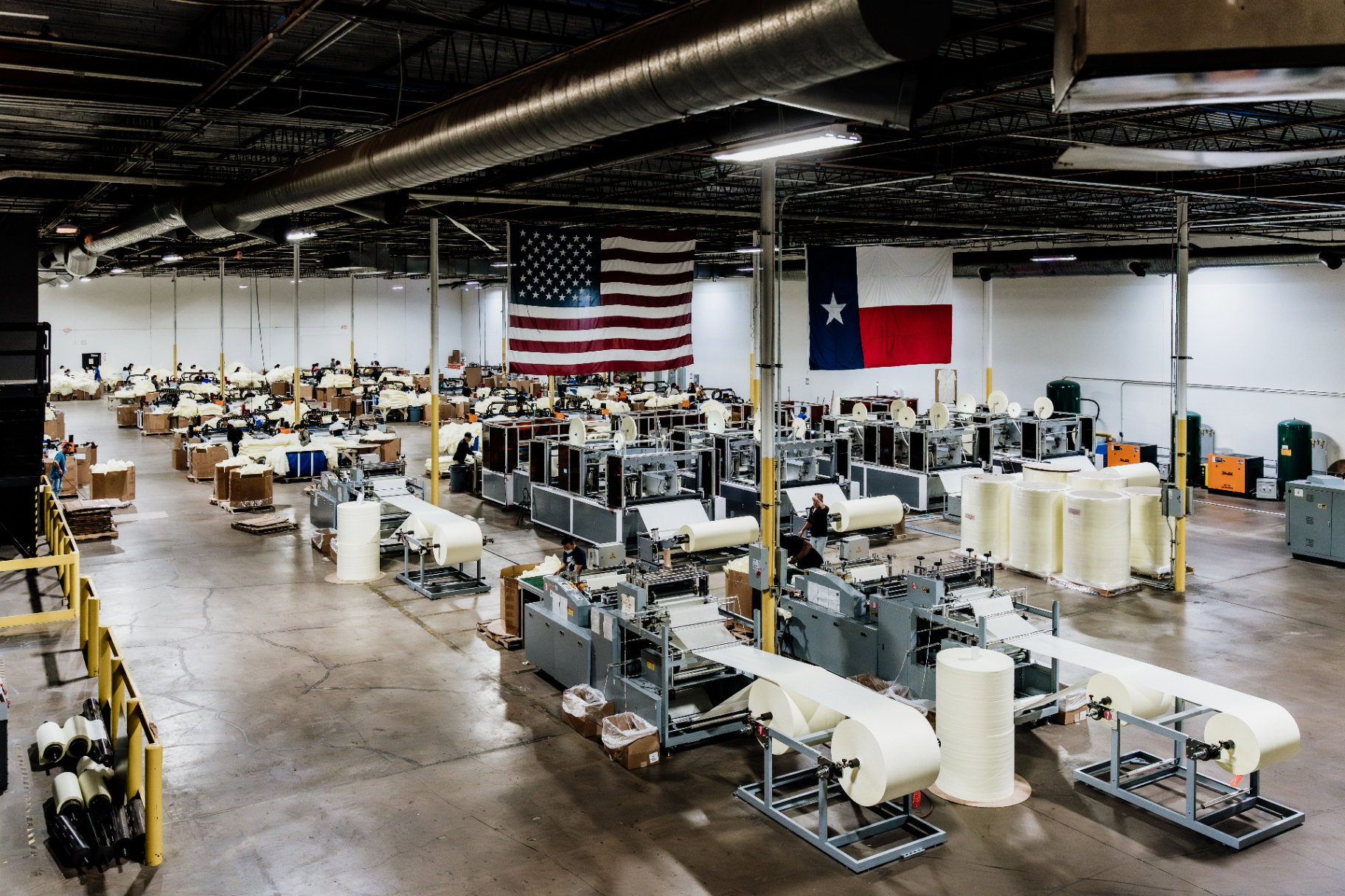 Wide mezzanine view of the Houston manufacturing floor showing multiple gown production lines