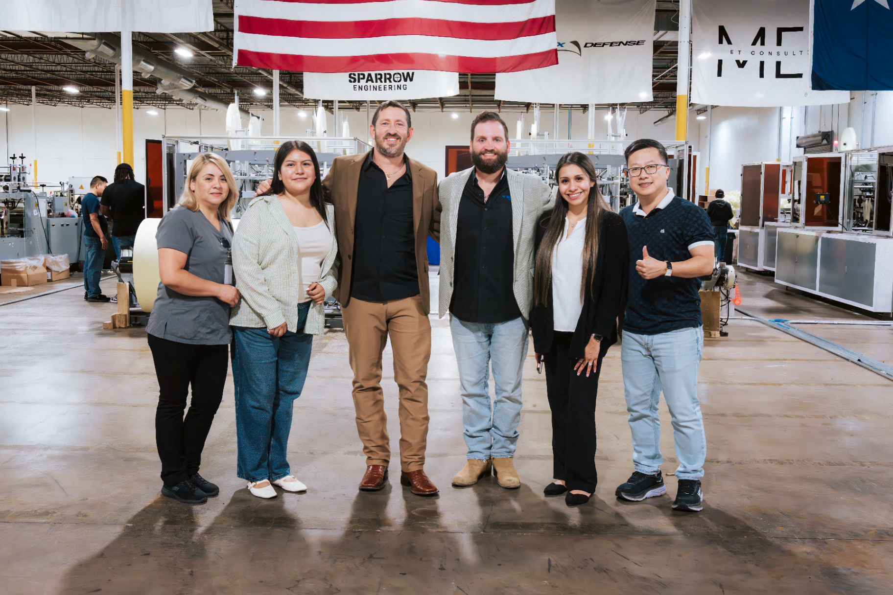 Sparrow Engineering leadership and team members standing together inside the Houston facility